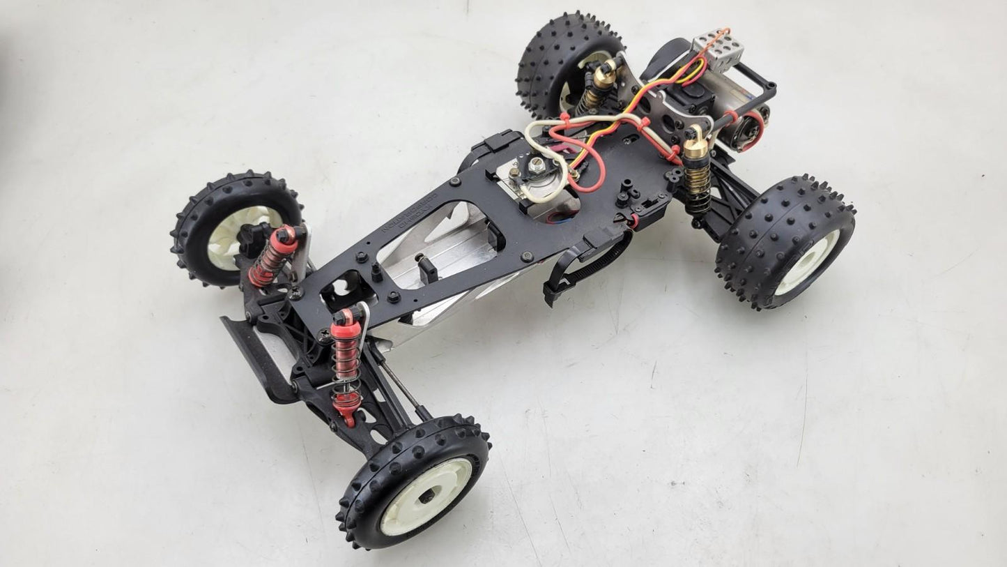 Team Kyosho Ultima 1/10th scale buggy, black and red