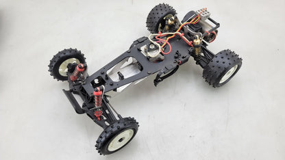 Team Kyosho Ultima 1/10th scale buggy, black and red