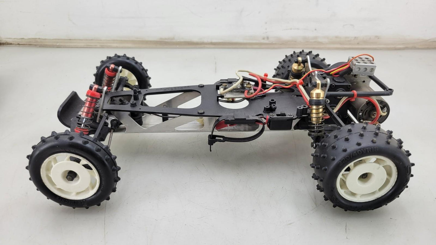 Team Kyosho Ultima 1/10th scale buggy, black and red
