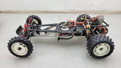 Team Kyosho Ultima 1/10th scale buggy, black and red