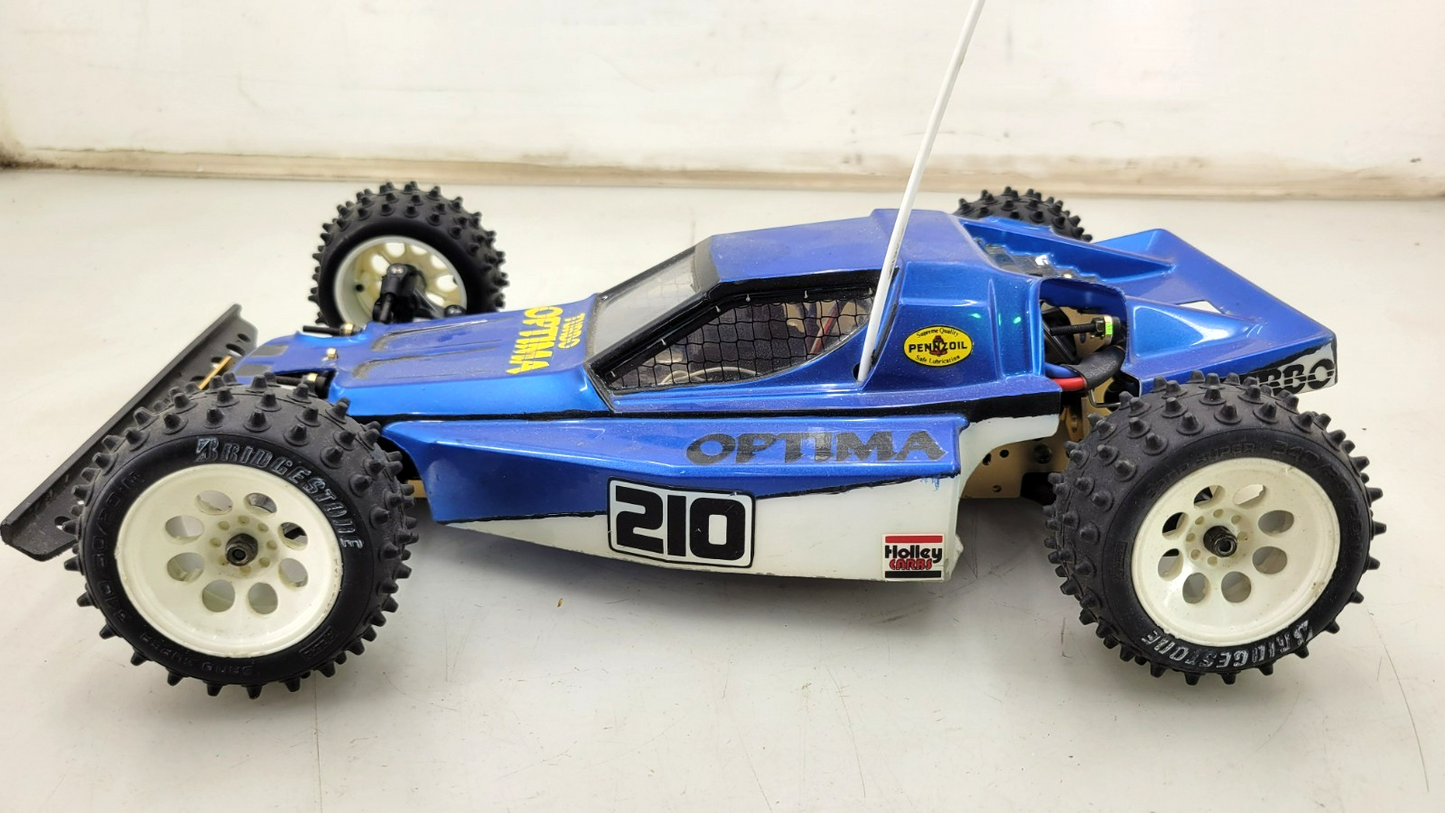 Kyosho Optima off-road racer gold chassis 1/10th scale, no transmitter, as is