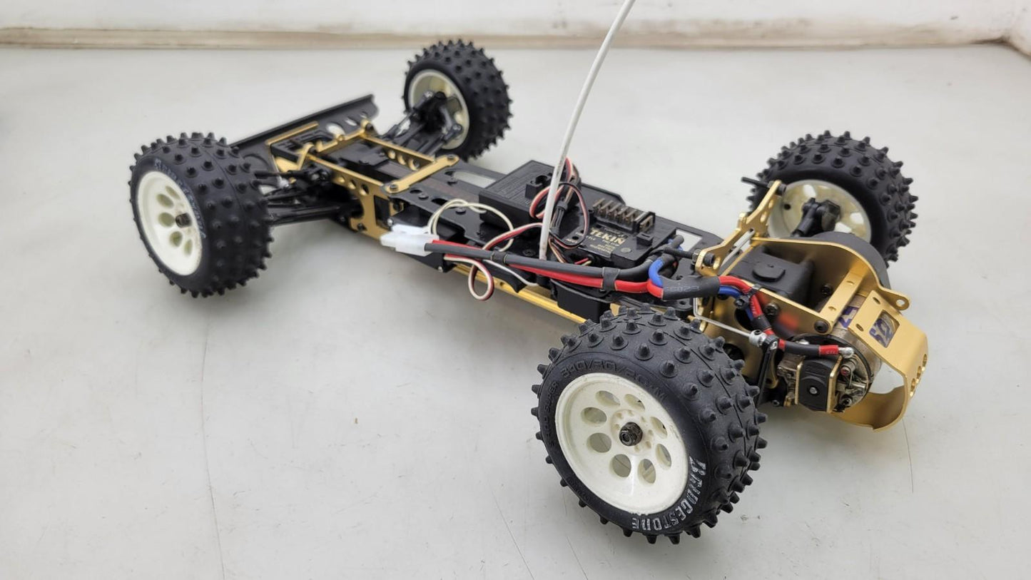 Kyosho Optima off-road racer gold chassis 1/10th scale, no transmitter, as is