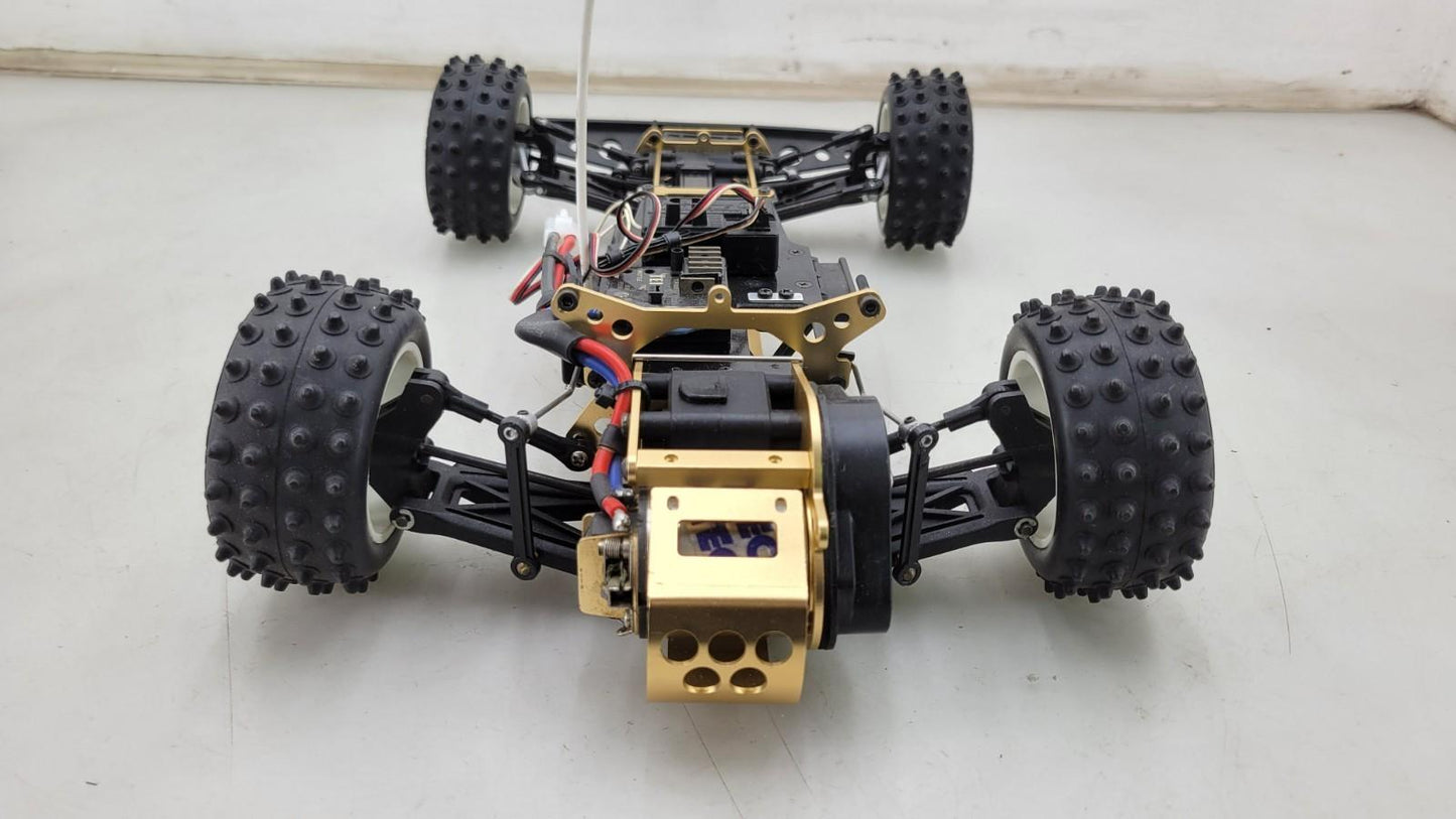 Kyosho Optima off-road racer gold chassis 1/10th scale, no transmitter, as is