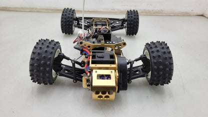 Kyosho Optima off-road racer gold chassis 1/10th scale, no transmitter, as is