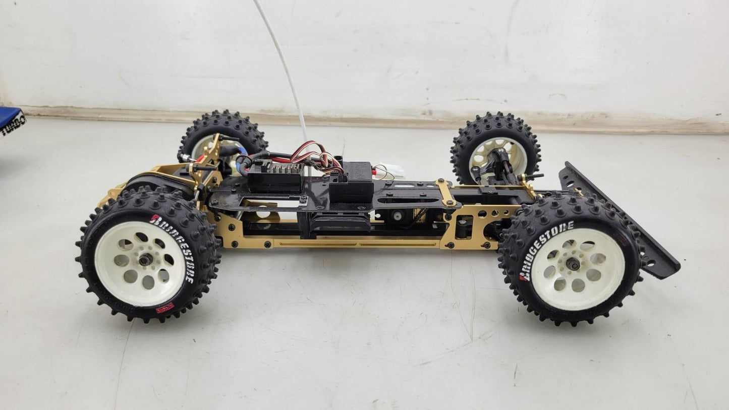 Kyosho Optima off-road racer gold chassis 1/10th scale, no transmitter, as is