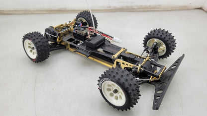 Kyosho Optima off-road racer gold chassis 1/10th scale, no transmitter, as is