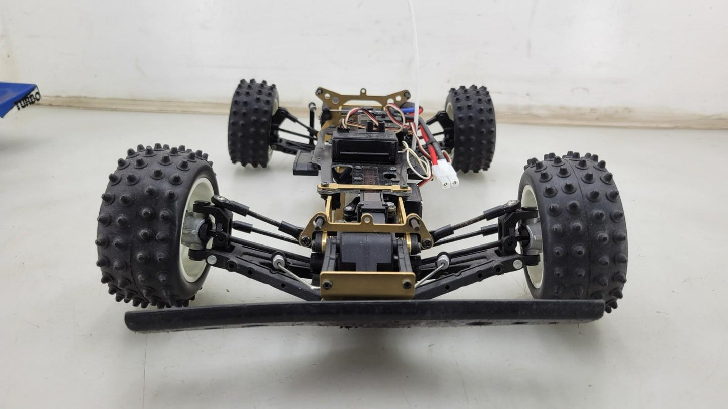 Kyosho Optima off-road racer gold chassis 1/10th scale, no transmitter, as is