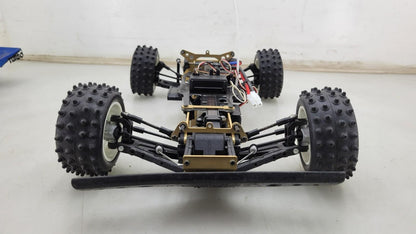 Kyosho Optima off-road racer gold chassis 1/10th scale, no transmitter, as is