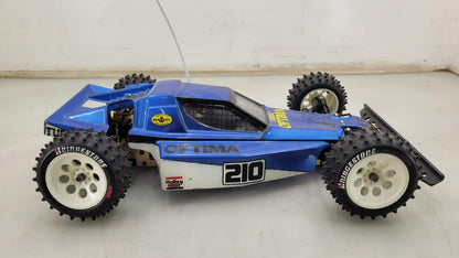 Kyosho Optima off-road racer gold chassis 1/10th scale, no transmitter, as is