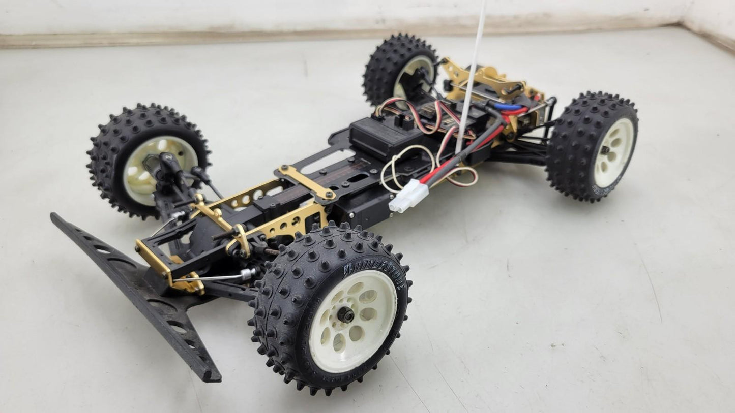 Kyosho Optima off-road racer gold chassis 1/10th scale, no transmitter, as is