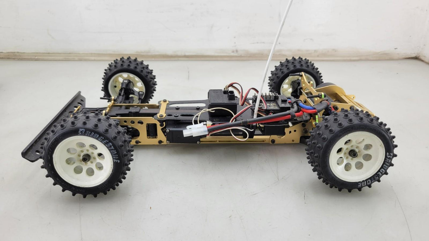 Kyosho Optima off-road racer gold chassis 1/10th scale, no transmitter, as is